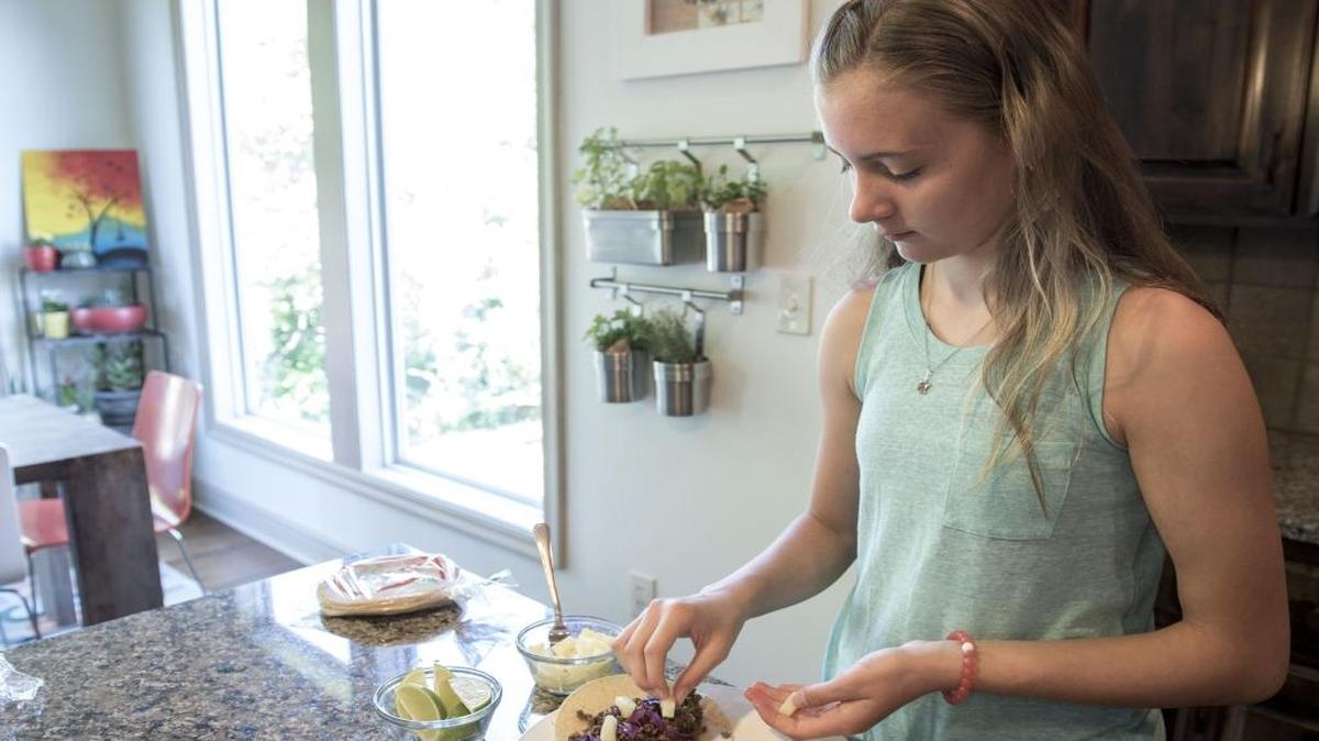 Joey Heidari, 12, demonstrates how she makes her lentil tacos with cilantro and avocado drizzle at the family home on Wednesday, July 6, 2016 in Olathe, Kansas. Heidari is the Kansas winner of the 2016 Healthy Lunchtime Challenge and Kids "State Dinner" and will meet First Lady Michelle Obama on July 14, 2016.