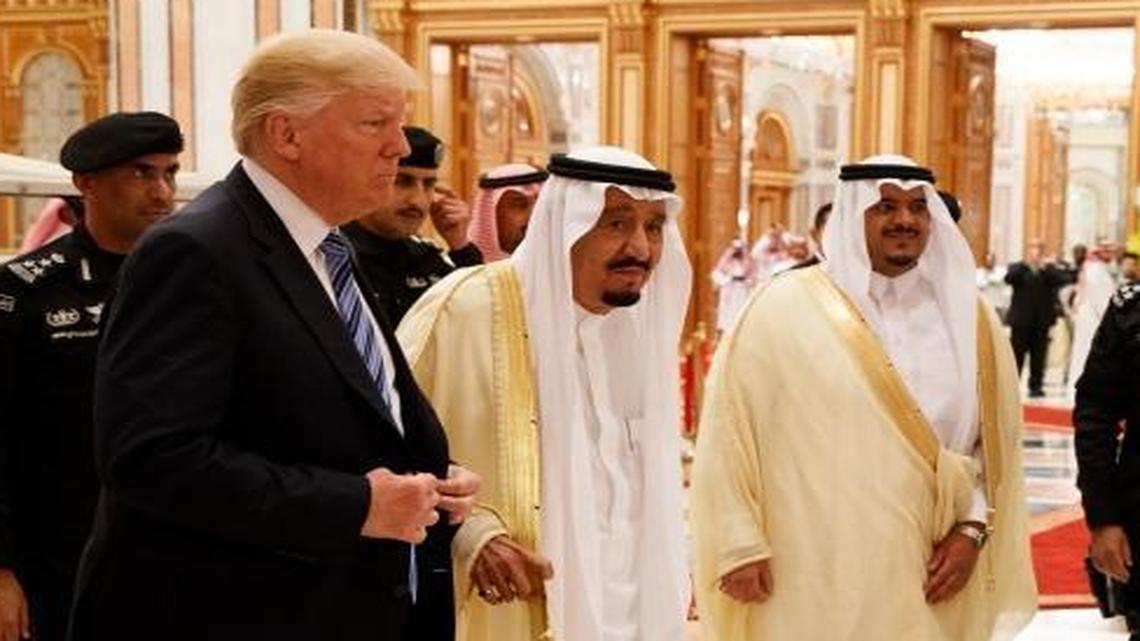 President Donald Trump and Saudi King Salman, center left, arrive to the Arab Islamic American Summit, at the King Abdulaziz Conference Center, Sunday, May 21, 2017, in Riyadh, Saudi Arabia.