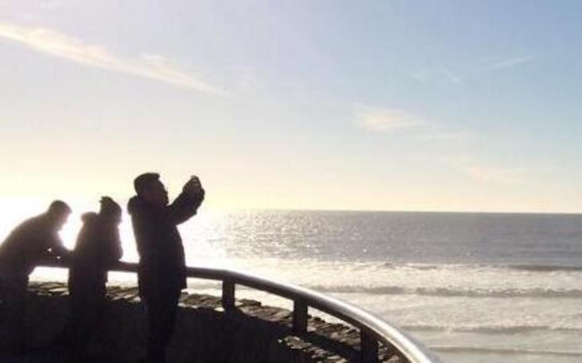 People look out where a border structure separates San Diego, right, from Tijuana, Mexico, left, Jan. 25, 2017. President Donald Trump has moved aggressively to tighten immigration controls.