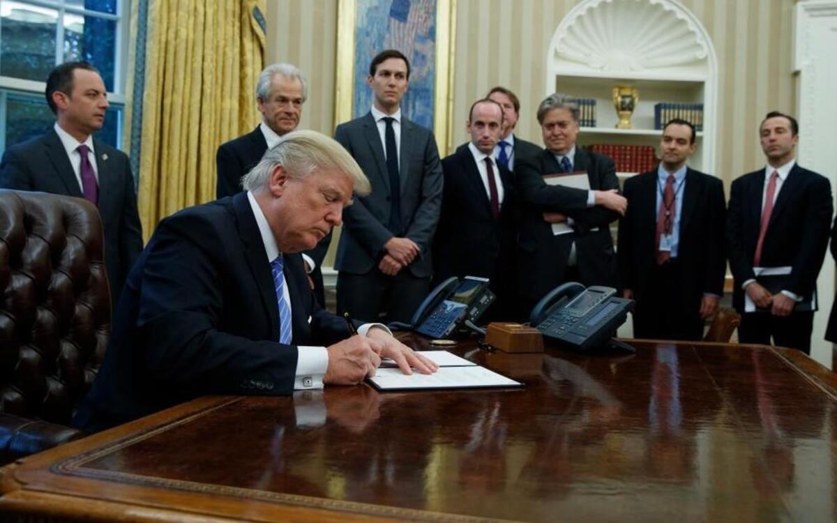 In one of his first acts, President Donald Trump signed an executive order implementing a federal government hiring freeze on Jan. 23, 2017.