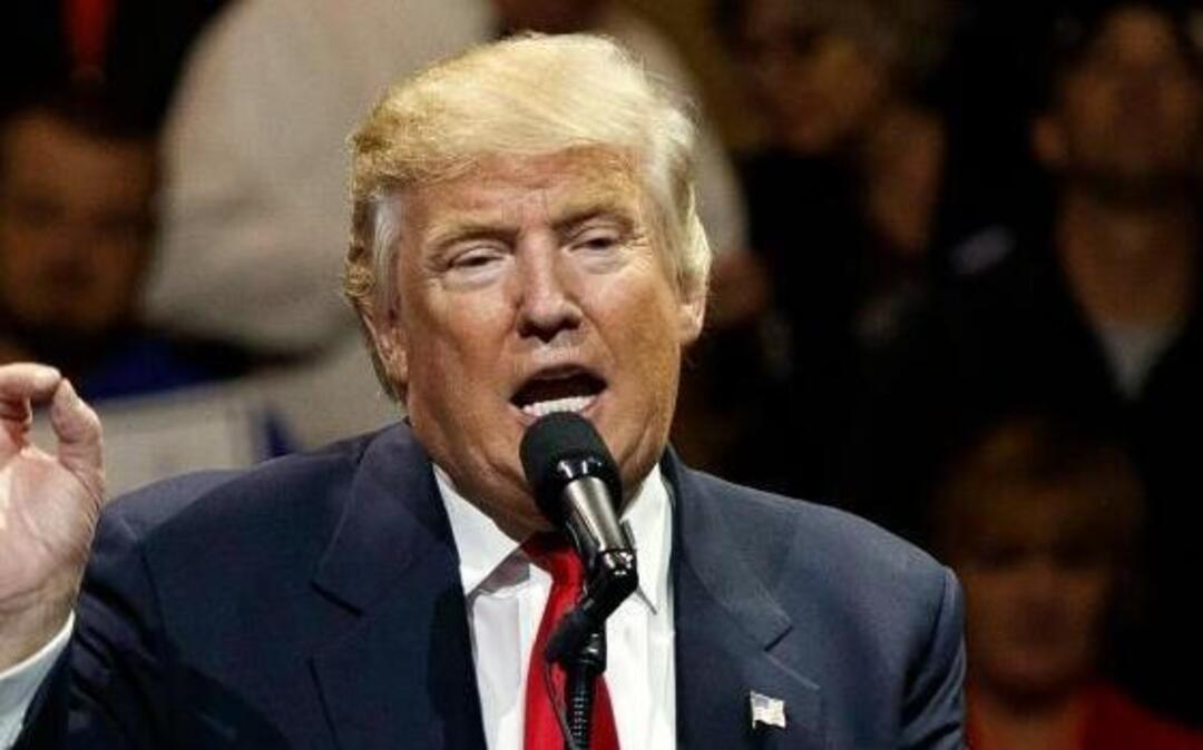 FILE - In this Dec. 1, 2016, photo, President-elect Donald Trump gestures as he speaks during a "USA Thank You" tour event in Cincinnati. Russiaâ€™s government staunchly denies reports that it tampered in the U.S. election or supported either candidate, but once the results were in, members of President Vladimir Putinâ€™s United Russia party didnâ€™t hold back.