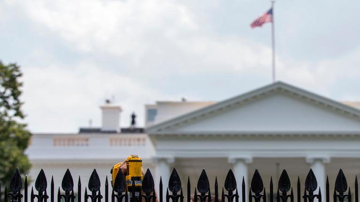 
A workers installs metal spikes onto the existing White House fence in Washington, Wednesday, July 1, 2015. The Secret Service says it will install sharp metal spikes on the White House fence after intruders scaled it twice in less than a year. In a news release, the Secret Service and National Park Service say the spikes are a temporary security measure until a long-term solution is found.
