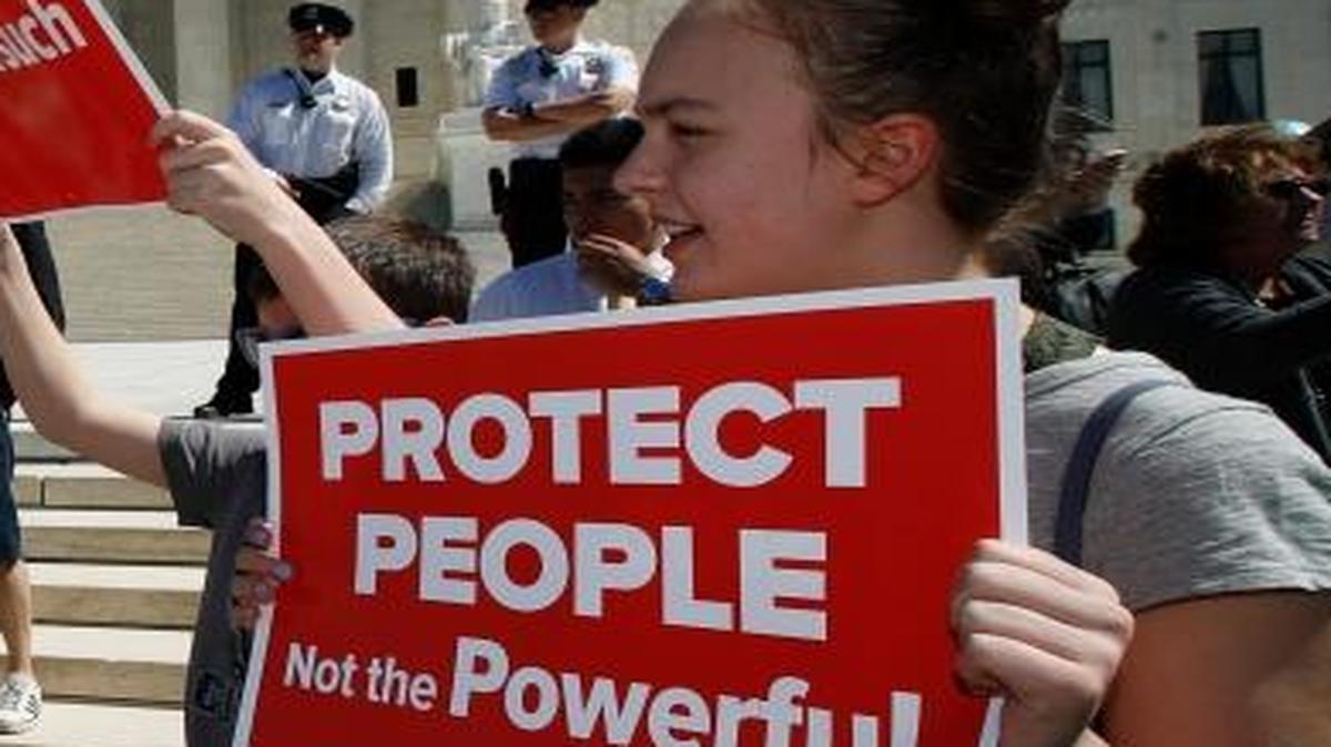 A group of protesters gather outside the Supreme Court in Washington.