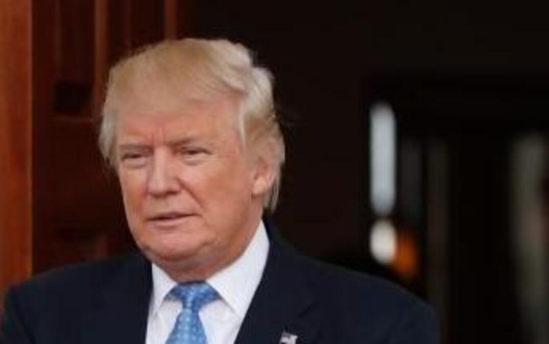 President-elect Donald Trump waits to greet former New York Mayor Rudy Giuliani as he arrives at the Trump National Golf Club Bedminster clubhouse, Sunday, Nov. 20, 2016, in Bedminster, N.J.