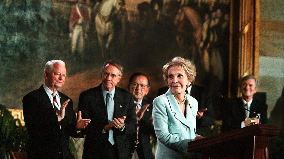 Nancy Reagan receives a standing ovation before being given the Congressional Gold Medal award during a ceremony for her and her husband, former President Ronald Reagan, at the U.S. Capitol in Washington in May 2002.