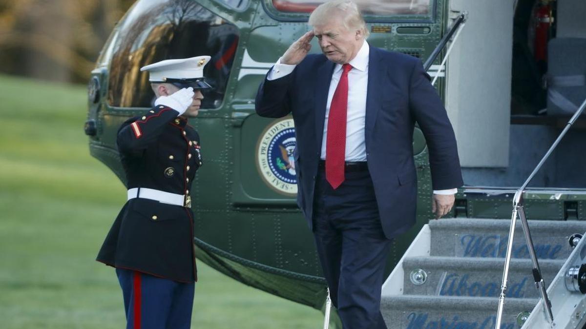 President Donald Trump salutes as he returns to the White House after a visit to his Mar-a-Lago estate last weekend. He met with two former presidents of Colombia while in Florida – a meeting that was unannounced.