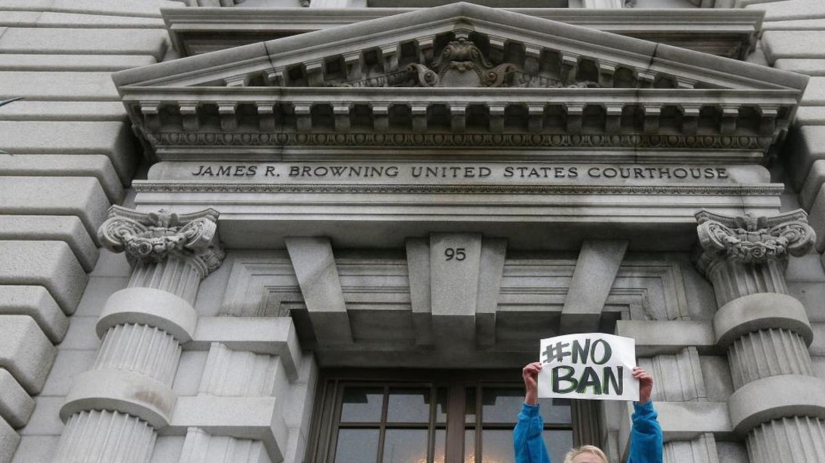 Karen Shore holds up a sign outside of the 9th U.S. Circuit Court of Appeals in San Francisco, Calif. in February.