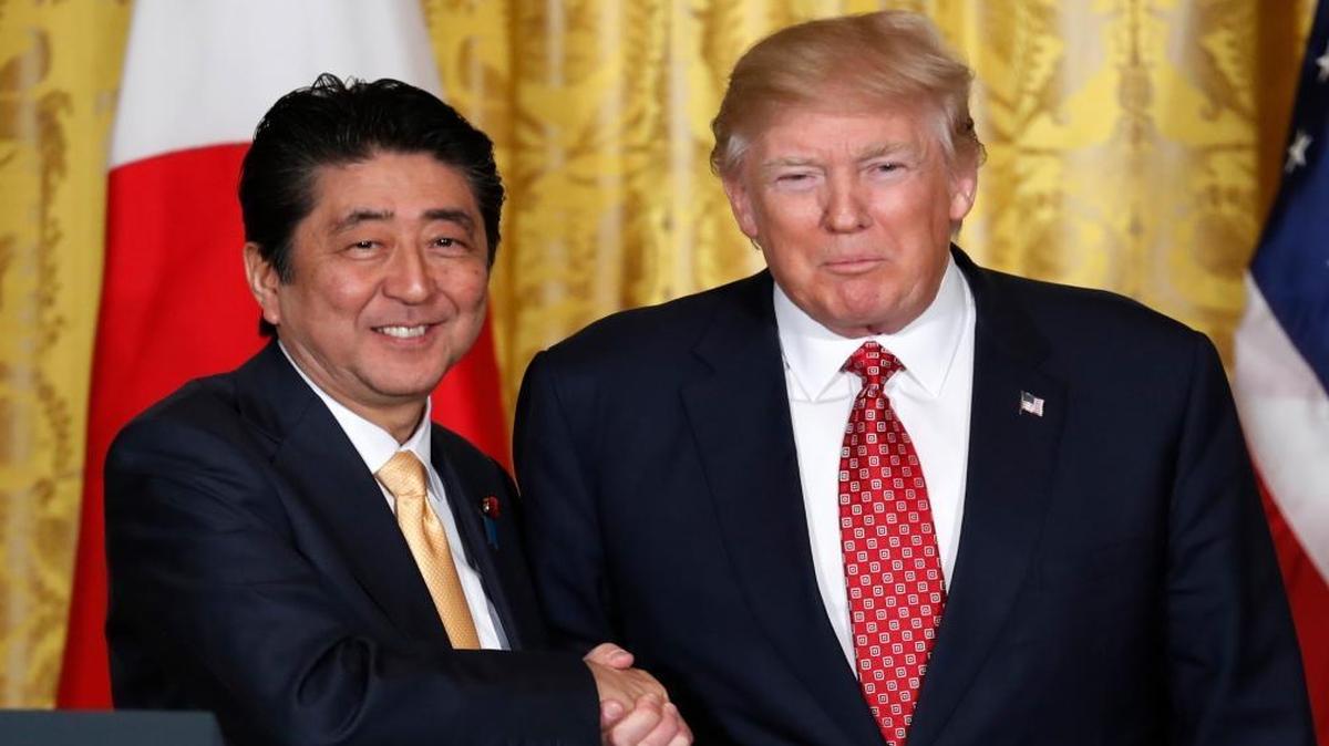 President Donald Trump and Japanese Prime Minister Shinzo Abe shakes hands following their joint news conference in the East Room of the White House in Washington, Friday, Feb. 10, 2017.