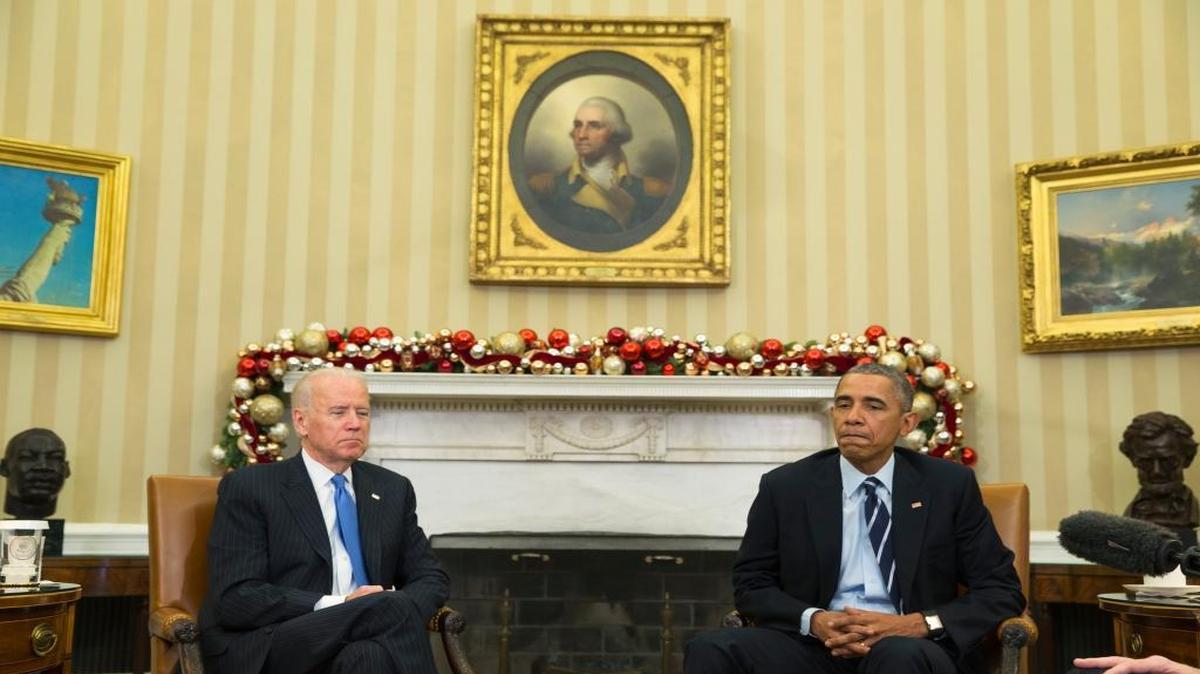 President Barack Obama, accompanied by Vice President Joe Biden, pauses Thursday in the Oval Office while making a statement on Wednesday’s mass shooting in San Bernardino, Calif.