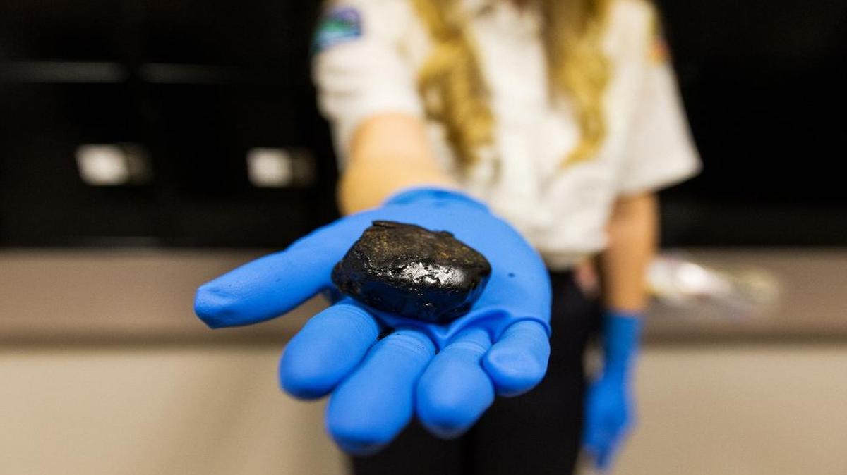 In this Jan. 27, 2016, photo, 39.6-grams of black tar heroin, with a street value of about $12,000, is among many other heroin-related items in Post Falls Police Department’s evidence room in Post Falls, Idaho.
