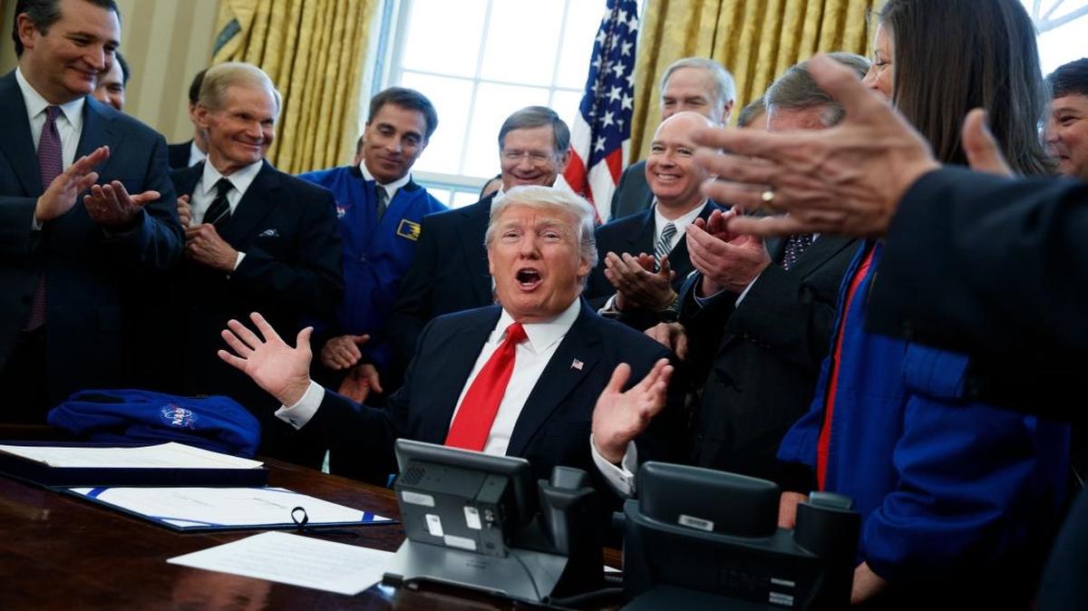 President Donald Trump speaks in the Oval Office of the White House in Washington, Tuesday, March 21, 2017, after signing a bill to increase NASA's budget to $19.5 billion and direct the agency to focus human exploration of deep space and Mars. Earlier in the day, Trump singled out U.S. Rep. Mark Meadows, R-N.C., over his opposition to a GOP bill that would repeal and replace Obamacare. Meadows has said he’s worried the proposal wouldn’t do enough to lower insurance premiums.
