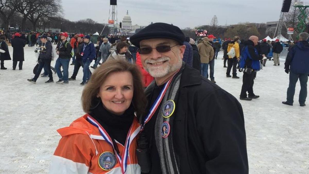 South Carolinians Mignonne Matheson and Hugh Gourlay stand on Washington’s National Mall and marvel at American democracy, in Washington, D.C., on Friday, Jan. 20, 2017.