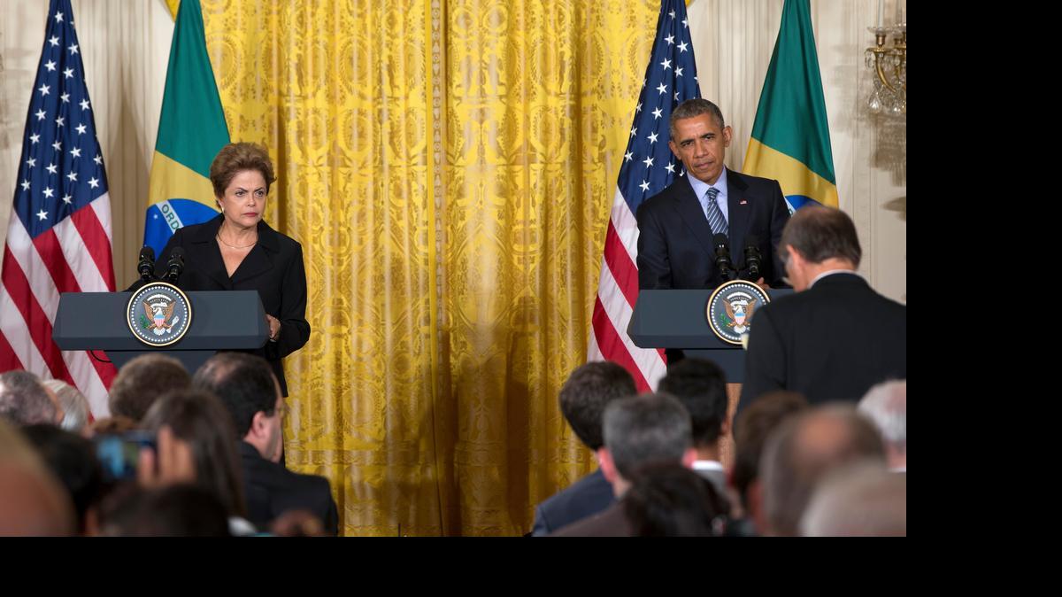 
President Barack Obama and Brazilian President Dilma Rousseff participate in a joint news conference in the East Room of the White House in Washington, Tuesday, June 30, 2015. The president and visiting Brazilian President Dilma Rousseff sought Tuesday to cast their nations as "natural partners" collaborating closely on critical issues like climate and regional diplomacy, glossing over recent tensions over spying that have strained relations between the U.S. and Brazil. 
