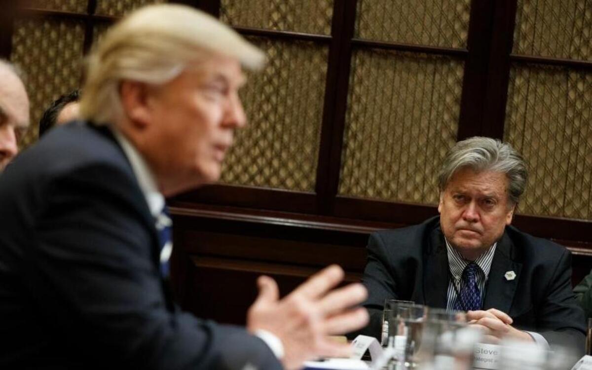 White House Chief Strategist Steve Bannon listens at right as President Donald Trump speaks during a meeting on cyber security in the Roosevelt Room of the White House in Washington, Tuesday, Jan. 31, 2017.
