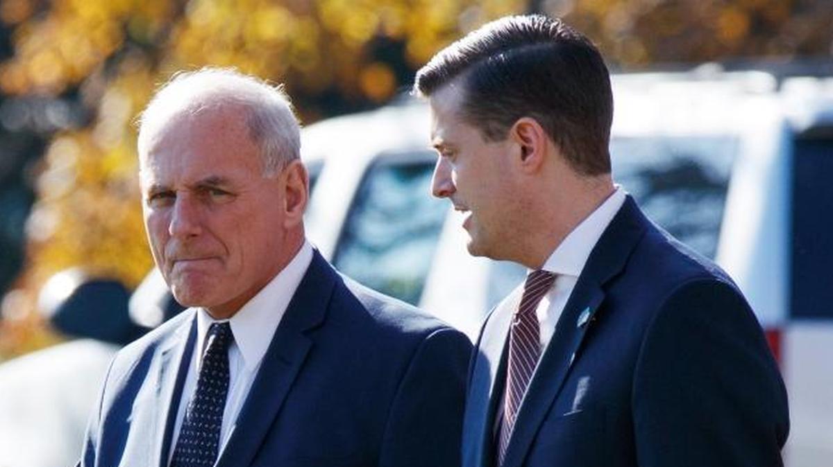 In this Nov. 29, 2017 file photo, White House Chief of Staff John Kelly, left, walks with White House staff secretary Rob Porter to board Marine One on the South Lawn of the White House in Washington.