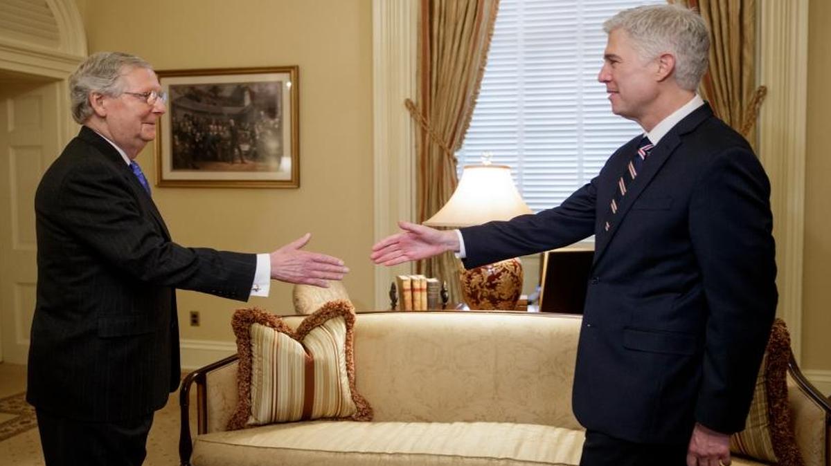 Supreme Court nominee Neil Gorsuch greets Senate Majority Leader Mitch McConnell, R-Ky., on Wednesday, Feb. 1, 2017.