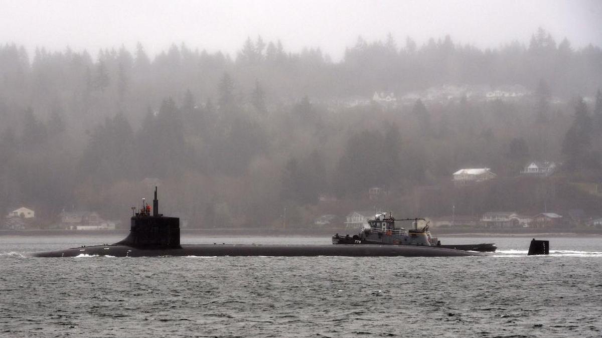 The attack submarine USS Seawolf transits through Washington state's Puget Sound after departing its homeport Naval Base Kitsap-Bremerton.