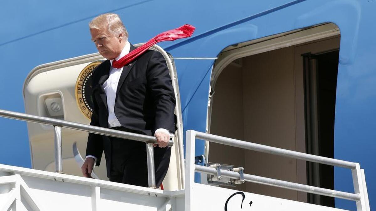 President Donald Trump steps off Air Force One as he arrives at Orlando International Airport, Friday, March 3, 2017, in Orlando, Fla.