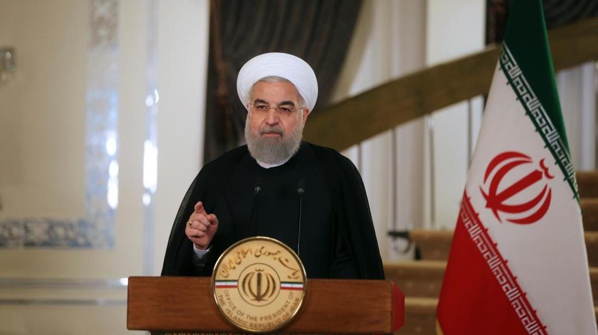 In this photo released by official website of the office of the Iranian Presidency, President Hassan Rouhani addresses the nation in a televised speech, in Tehran, Iran, Friday, Oct. 13, 2017. Rouhani spoke after U.S. President Donald Trump angrily accused Iran of violating the spirit of the 2015 accord and demanded Congress toughen the law governing U.S. participation.