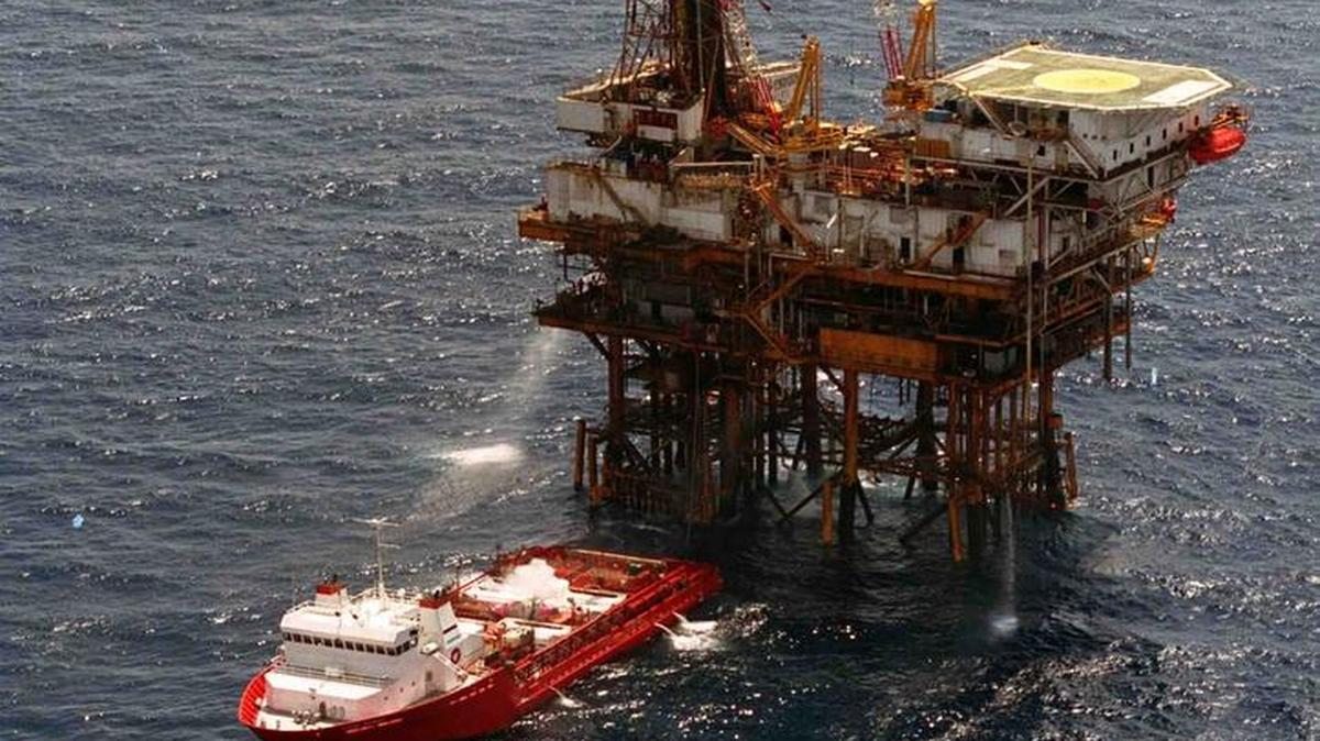 In this undated photo, a boat nears an offshore oil rig in the Gulf of Mexico. The Obama administration announced plans Thursday, Feb. 18, 2016, to open 45 million additional acres of offshore Gulf waters for oil and gas development and exploration.