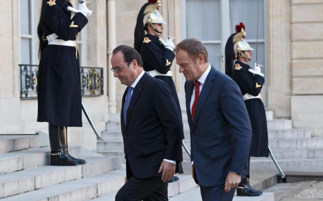 France’s President Francois Hollande, left, welcomes European Council President Donald Tusk at the Elysee Palace in Paris, Monday, Nov. 23, 2015. European Union President Donald Tusk has said it is a political duty to jointly fight extremism, calling it the “greatest challenge of our time.”