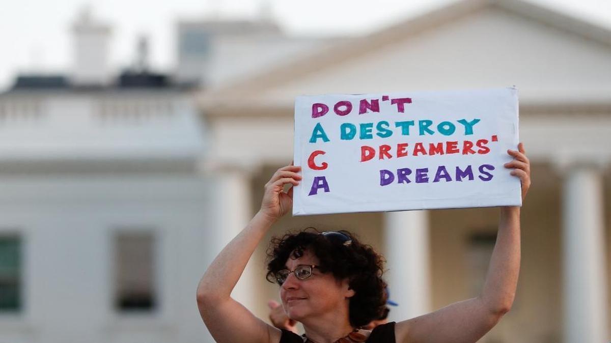 Julia Paley, of Arlington, Va., holds up a sign that reads "DACA Don't Destroy Dreamers Dreams" during a rally supporting Deferred Action for Childhood Arrivals, or DACA, outside the White House, in Washington, Monday, Sept. 4, 2017.