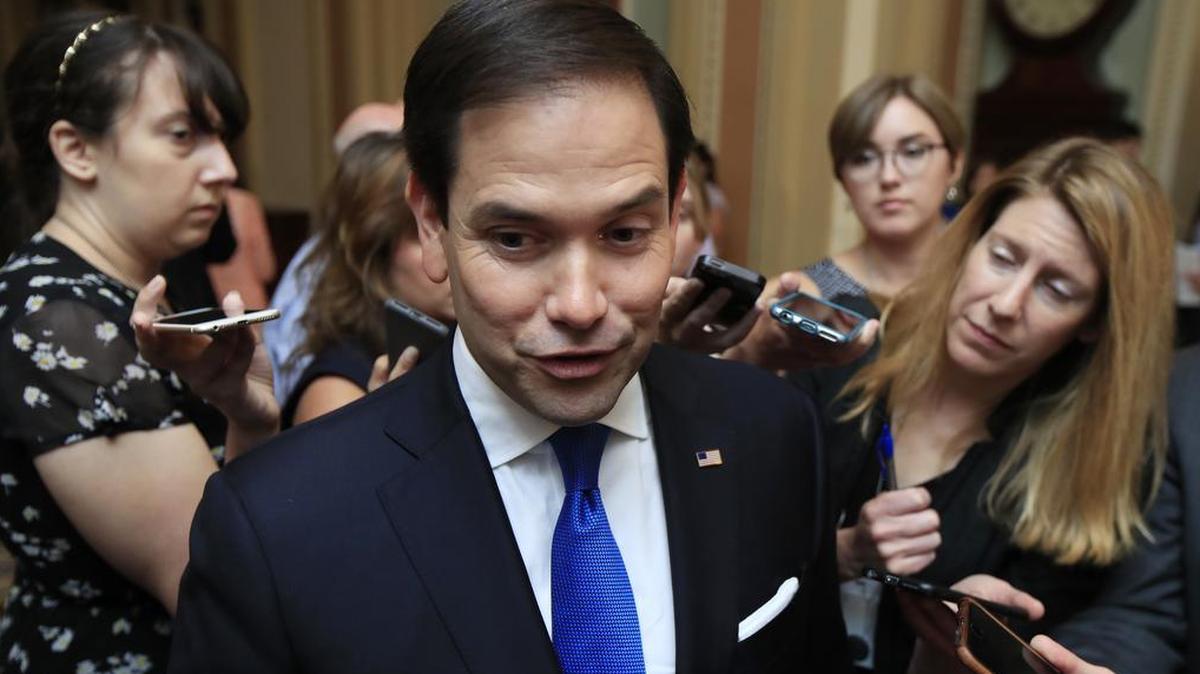 Sen. Marco Rubio, R-Fla. speaks to reporters as he walks toward the Senate floor on Capitol Hill.