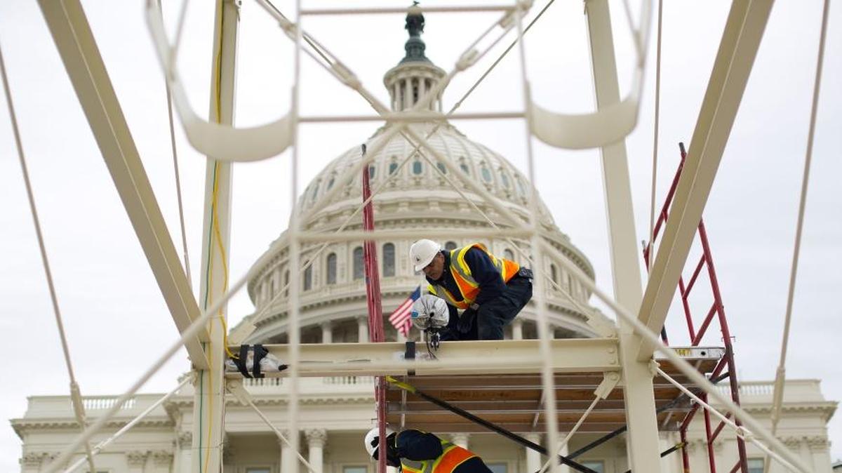 In this Dec. 8, 2016 file photo, construction continues on the Inaugural platform in preparation for the Inauguration and swearing-in ceremonies for President-elect Donald Trump, on the Capitol steps in Washington.