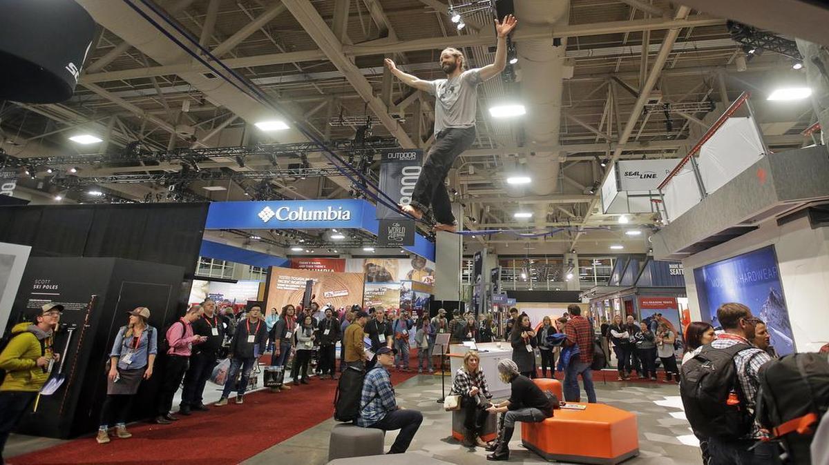 A slackliner balances amid crowds attending the Outdoor Retailer trade show at the Salt Palace Convention Center in Salt Lake City on Jan. 11, 2017. The Outdoor Industry Association decided in February to move its trade show to another state starting in 2018, to rebuff Utah’s top political leaders after they lobbied President Donald Trump to rescind the new Bears Ears National Monument designation in south Utah.