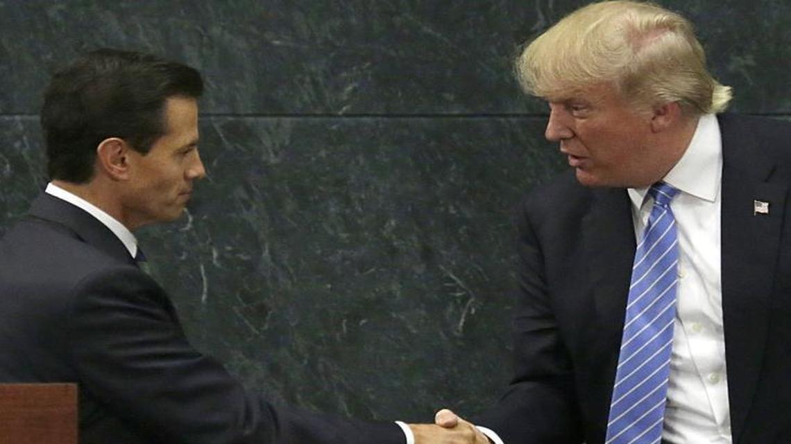 Mexico's President Enrique Pena Nieto and Republican presidential nominee Donald Trump shake hands on Aug. 31, 2016, after a joint statement at Los Pinos, the presidential official residence, in Mexico City.