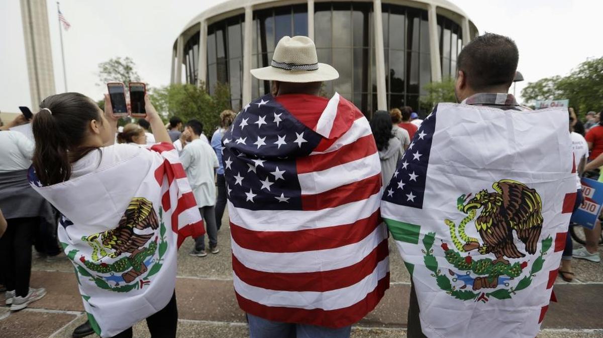 Protesters outside the federal courthouse in San Antonio, Texas, take part in a rally to oppose a new Texas "sanctuary cities."