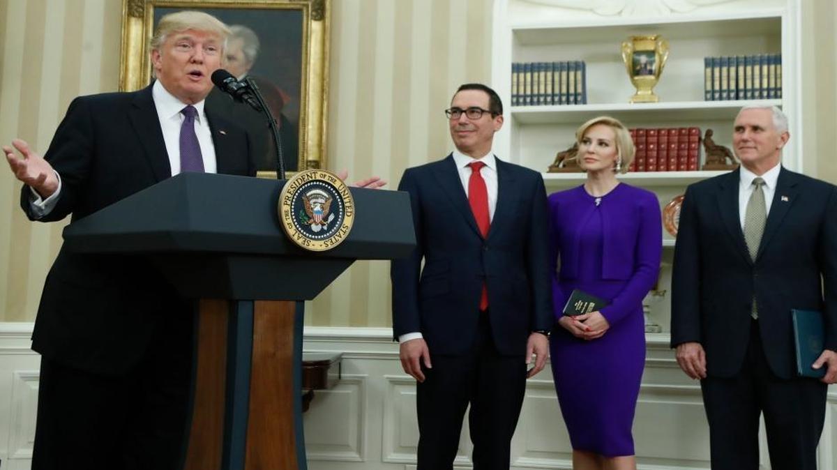 Vice President Mike Pence, far right, administers the oath of office to newly confirmed Treasury Secretary Steven Mnuchin on Feb. 13, 2017. Mnuchin was accompanied by his fiancée, Scottish actress Louise Linton. President Trump made remarks before the oath was administered.