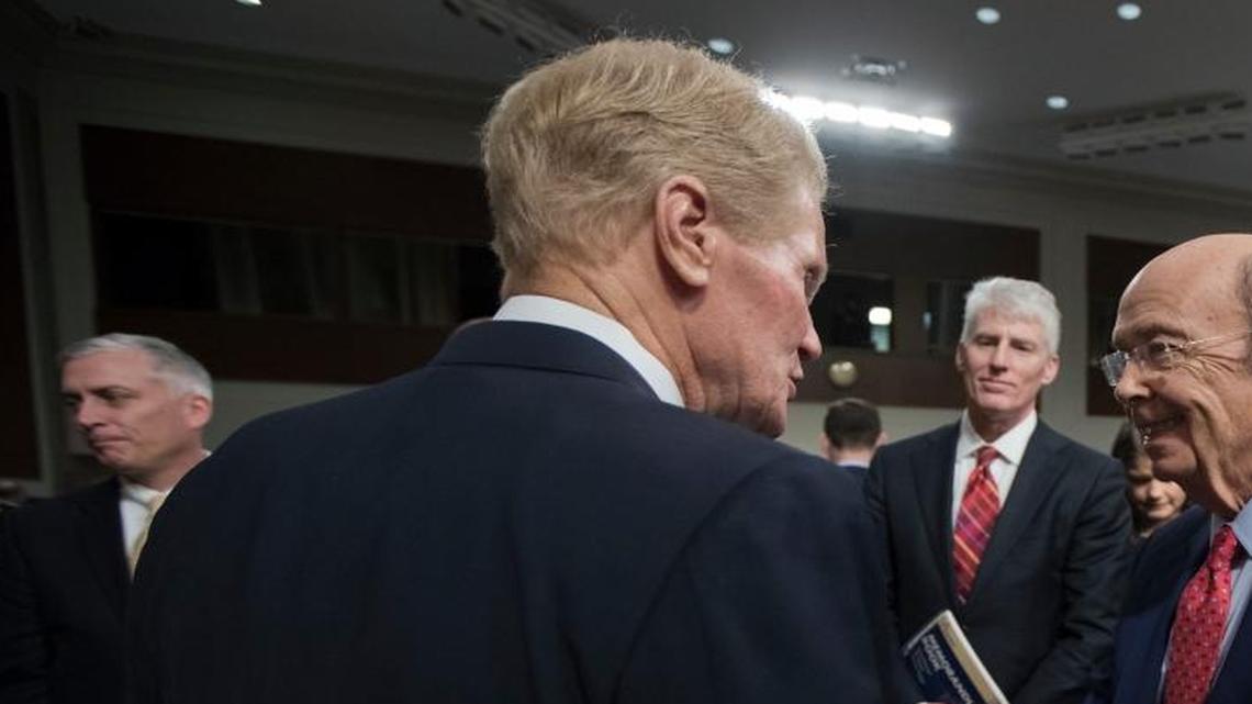The Senate Commerce Committee's ranking member, Sen. Bill Nelson, D-Fla., left, with Commerce Secretary-designate Wilbur Ross. If confirmed by the Senate, Ross would oversee the National Oceanic and Atmospheric Administration, whose climate scientists fear what a Trump administration could mean for them.