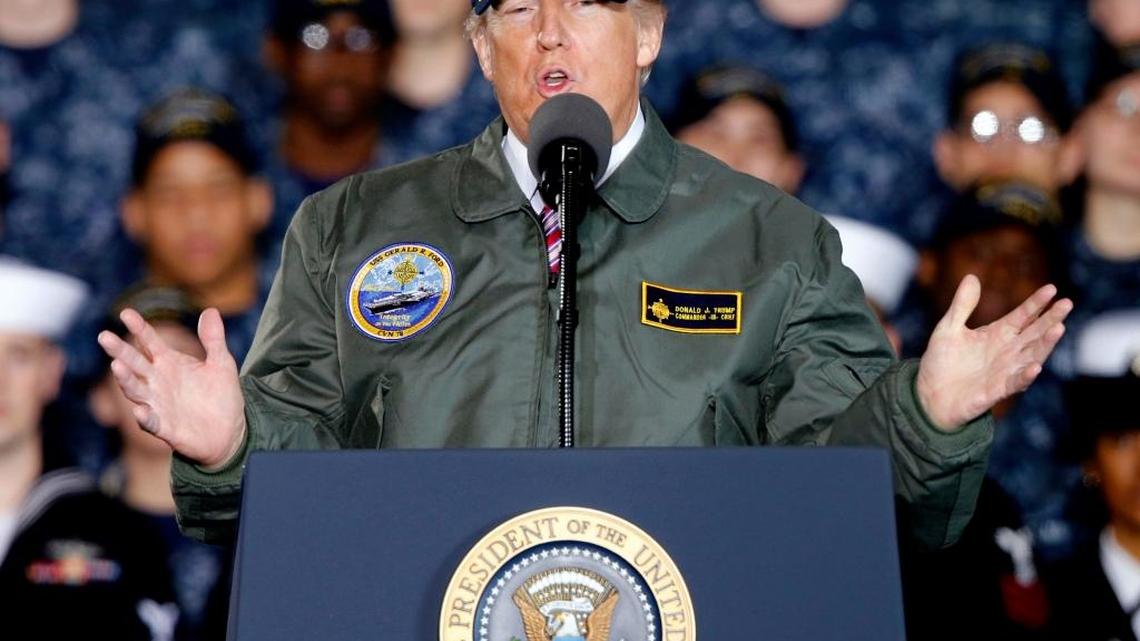 In this March 2, 2017, photo, President Donald Trump gestures as he speaks to Navy and shipyard personnel aboard nuclear aircraft carrier Gerald R. Ford at Newport News Shipbuilding in Newport News, Va.