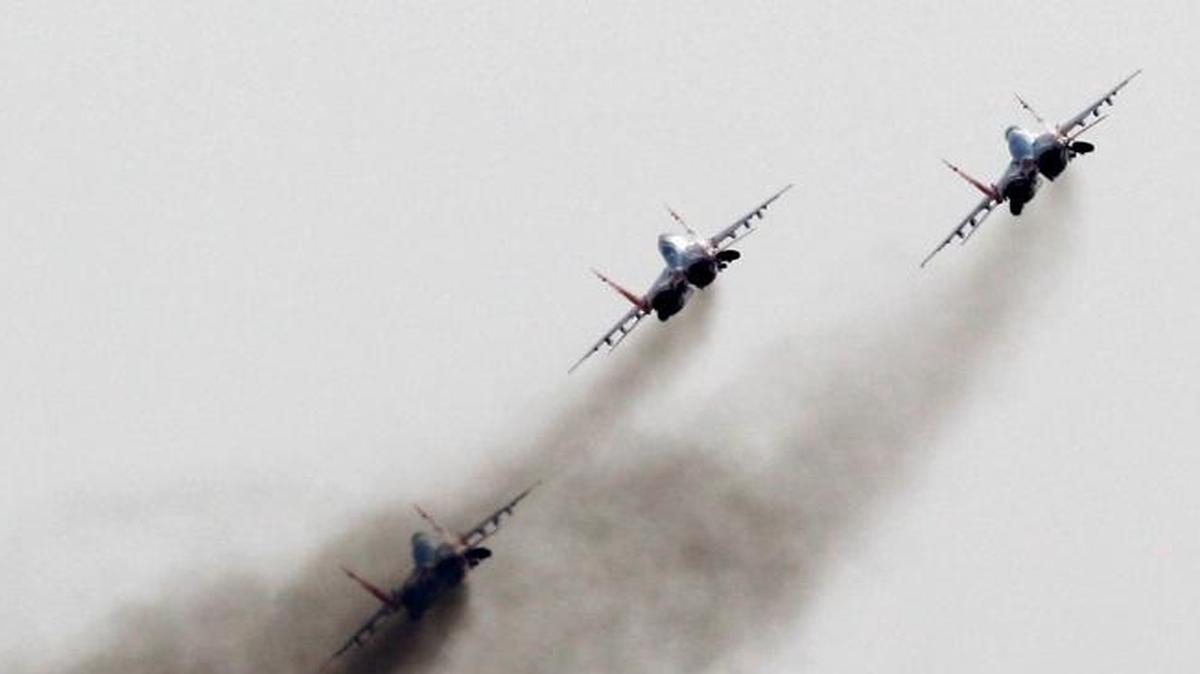 Russia’s military buildup continues at the planned pace despite its economic troubles. This photo, from Sept 1, 2012, from early in that buildup, show Mig-29 jet fighters of the Russian aerobatic team Strizhi (Swifts) performing in Batajnica, military airport near Belgrade, Serbia.