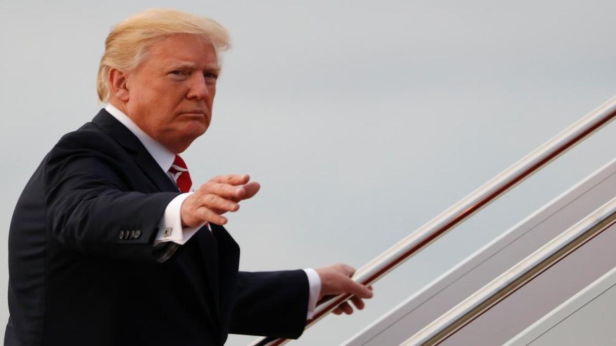 President Donald Trump waves as he boards Air Force One, Saturday, Oct. 7, 2017, in Andrews Air Force Base, Md., en route to a fundraiser in Greensboro, N.C.