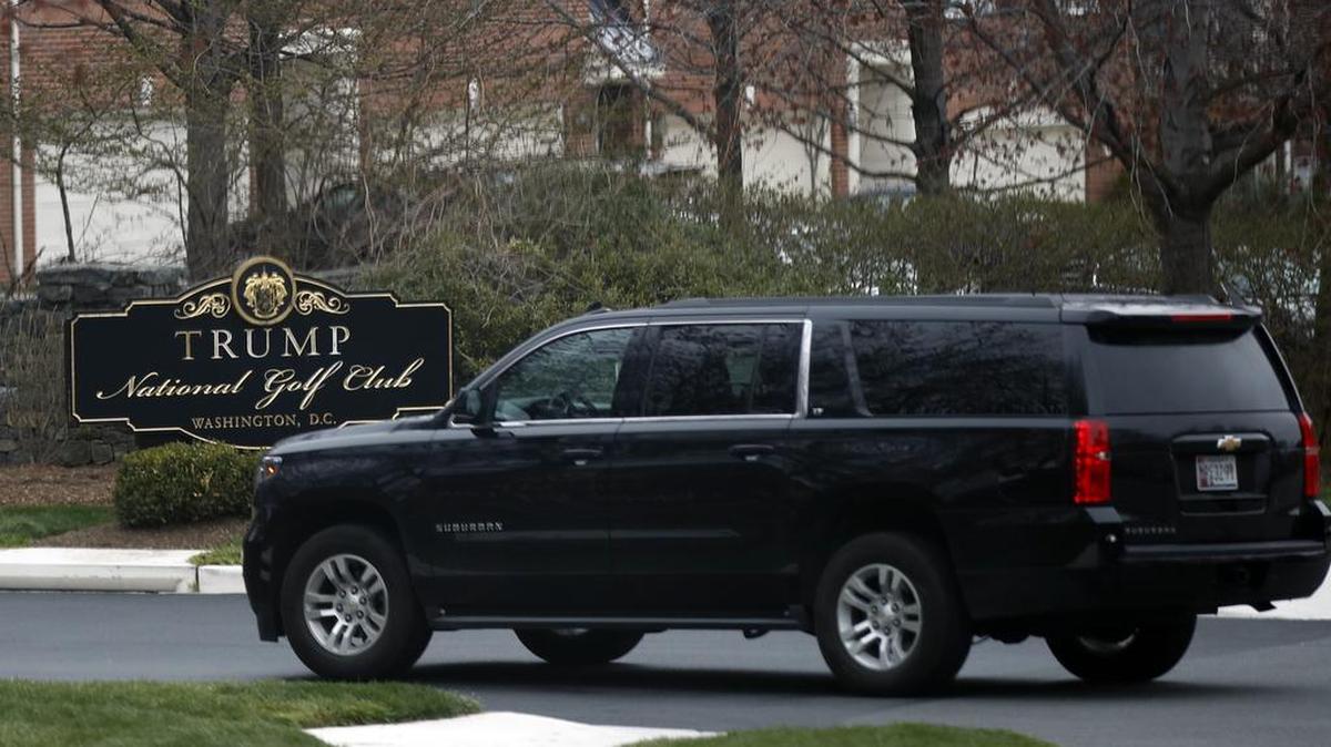 A vehicle with President Donald Trump's motorcade enters the Trump National Golf Club in Potomac Falls, Va., Sunday, March 26, 2017.
