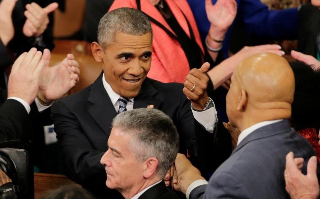 President Barack Obama gestures as he arrives on Capitol Hill in Washington on Tuesday, Jan. 12, 2016, before giving his State of the Union address before a joint session of Congress.