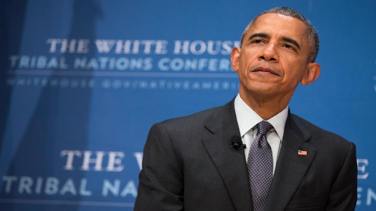 President Barack Obama pauses after speaking at the 2015 White House Tribal Nations Conference, Thursday, Nov. 5, 2015, in Washington. In conjunction with the conference, shoe company and apparel maker Adidas announced it will provide free design resources to schools looking to shelve Native American mascots, nicknames, imagery or symbolism.