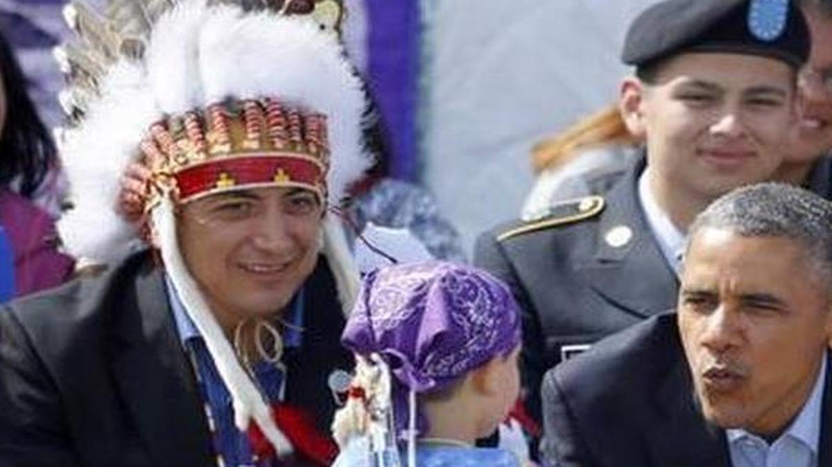 
President Barack Obama wants more Indian tribes to run federally controlled schools. Here he’s shown with two young boys during a Native American dance on the Standing Rock Indian Reservation in Cannon Ball, N.D., on June 13, 2014.
