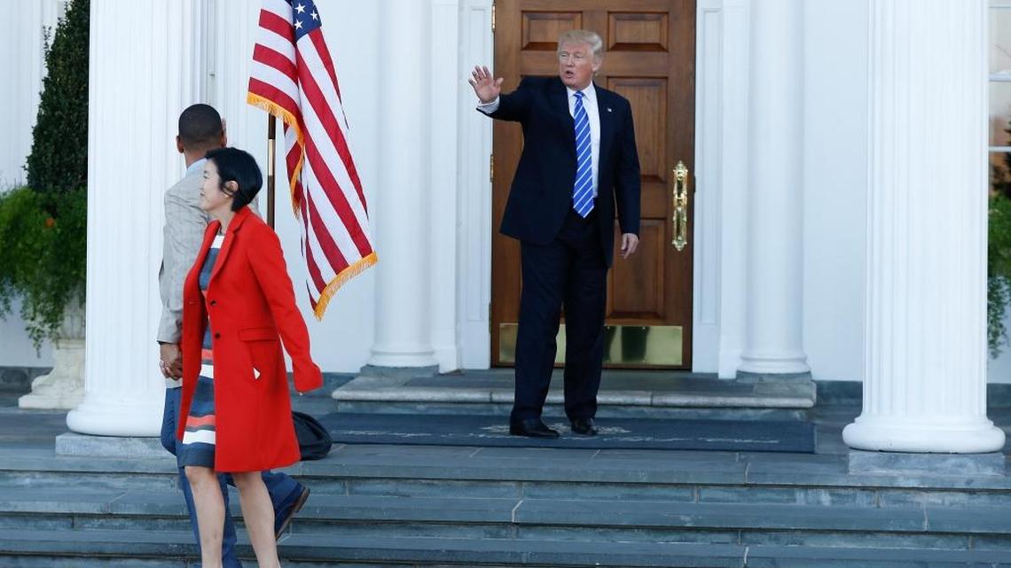 President-elect Donald Trump waves as Michelle Rhee, a former chancellor of Washington, D.C., schools, and her husband, outgoing Sacramento Mayor Kevin Johnson, leave Trump National Golf Club Bedminster in Bedminster, N.J.