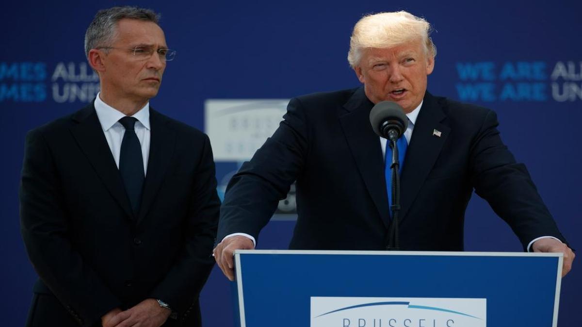 NATO Secretary General Jens Stoltenberg and President Donald Trump during a ceremony to unveil artifacts from the World Trade Center and Berlin Wall for the new NATO headquarters, Thursday, May 25, 2017, in Brussels.