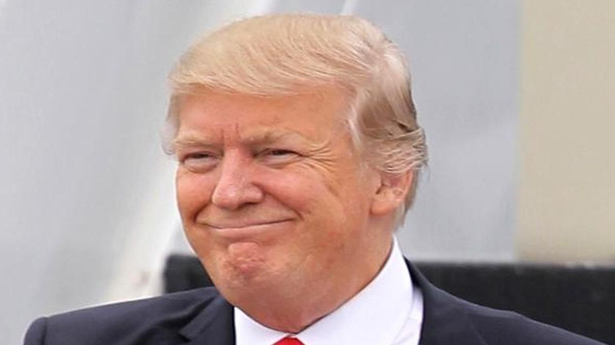 In this Friday, March 3, 2017, file photo, President Donald Trump walks down the stairs of Air Force One upon his arrival at Palm Beach International Airport in West Palm Beach, Fla.