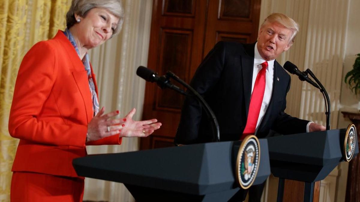 President Donald Trump speaks during a news conference with British Prime Minister Theresa May in the East Room of the White House in Washington.