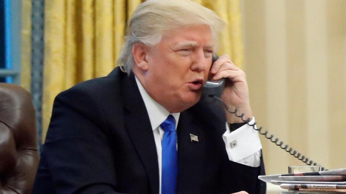 In this photo taken Jan. 28, 2017, President Donald Trump speaks on the phone with Australian Prime Minister Malcolm Turnbull in the Oval Office of the White House in Washington. Transcripts of President Donald Trump’s conversations with the leaders of Mexico and Australia in January offer new details on how the president parried with the leaders over the politics of the border wall and refugee policy, with random asides on subjects including drug abuse in New Hampshire.