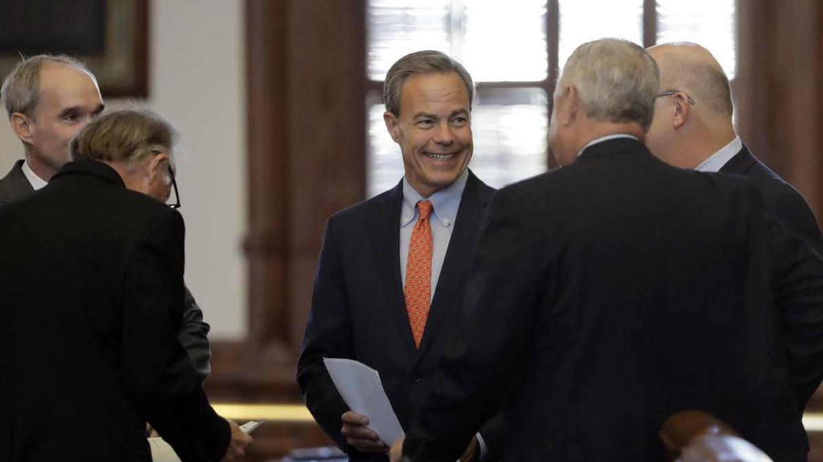 Texas Speaker of the House Joe Straus, R-San Antonio, center, visits with fellow lawmakers on the House floor in Austin, Texas, Tuesday, July 18, 2017.