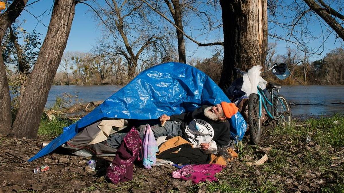 Danny Rasmussen, 69, has lived along the American River for 15 years. Sacramento is on the verge of implementing a new plan to address homlessness, although it would depend on uncertain pools of federal funding.