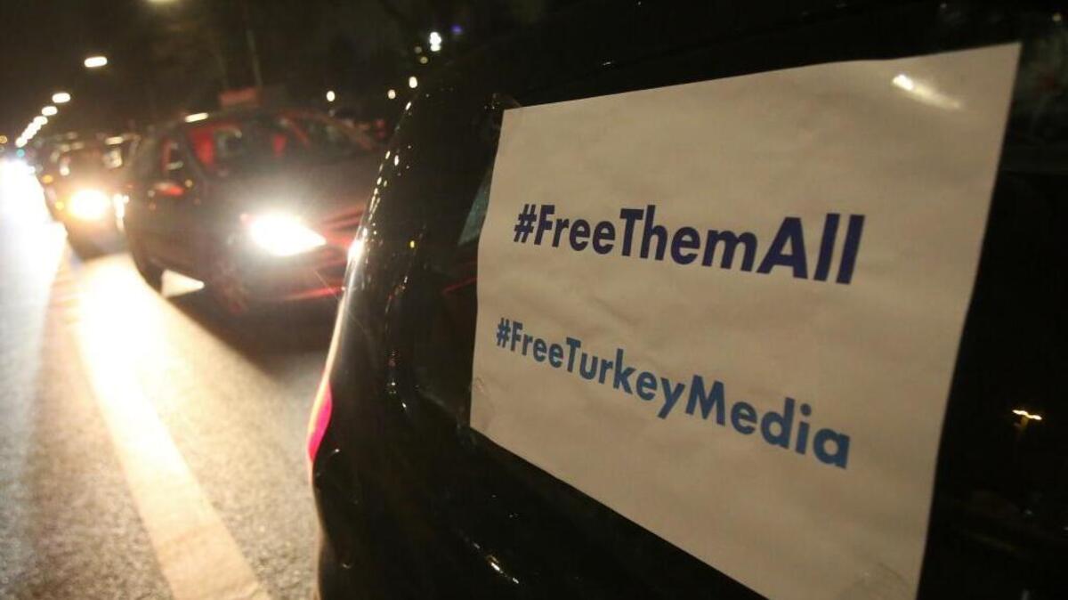 A signs is attached to a car which reads '#FreeThemAll' and 'FreeTurkeyMedia' as friends, colleagues and supporters of German-Turkish journalist Deniz Yucel, drive in a motorcade through the streets in Berlin, Germany, 16 February 2018. After spending one year in prison, Yucel, who works as a foreign correspondent for 'Die Welt' newspaper, was released from the correctional facility in Silivri near Istanbul. A court had ordered the release after the Turkish prosecution had submitted the indictment. Photo by: Bodo Marks/picture-alliance/dpa/AP Images
