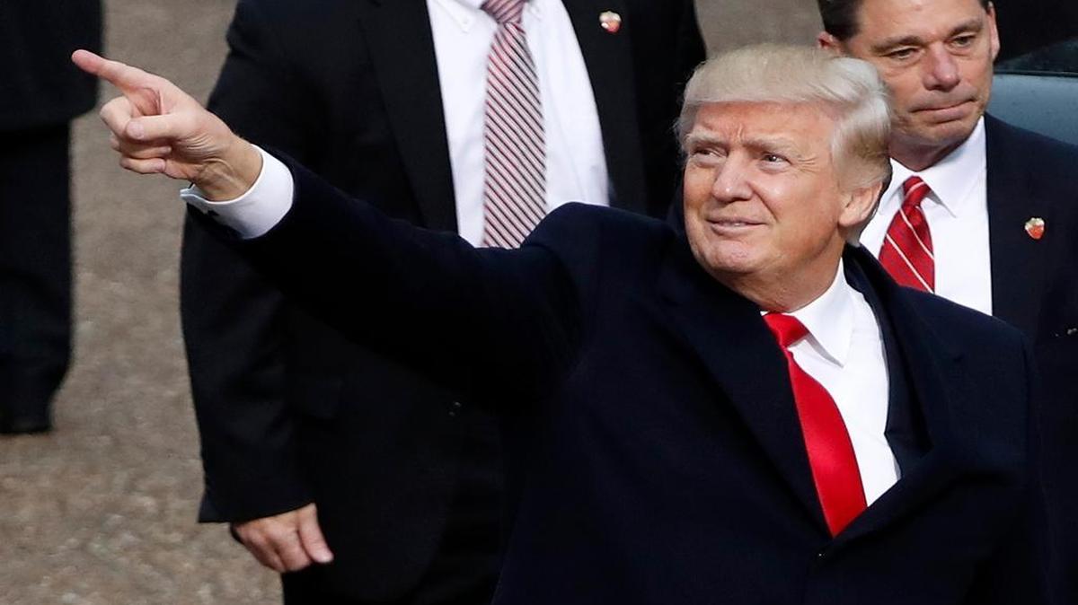 President Donald Trump points during his inauguration parade in Washington on Friday.