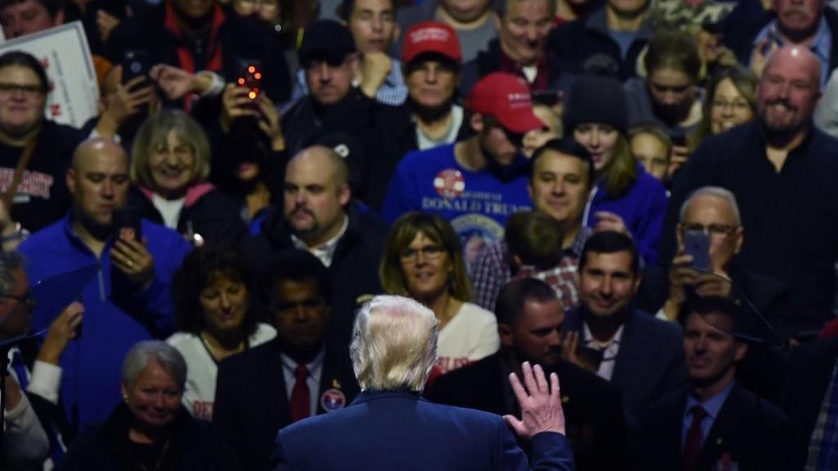 President-elect Donald Trump greets teh audience during the USA Thank You Tour at the US Bank Arena in Cincinnati, Ohio on December 1.
